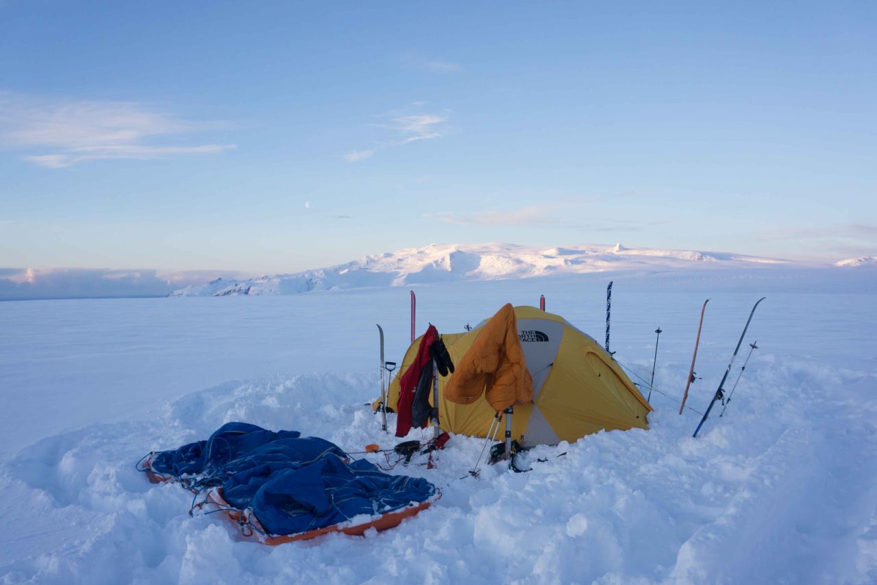A tent camped on a glacier on a sunny day on a polar training course with Icelandic Mountain Guides