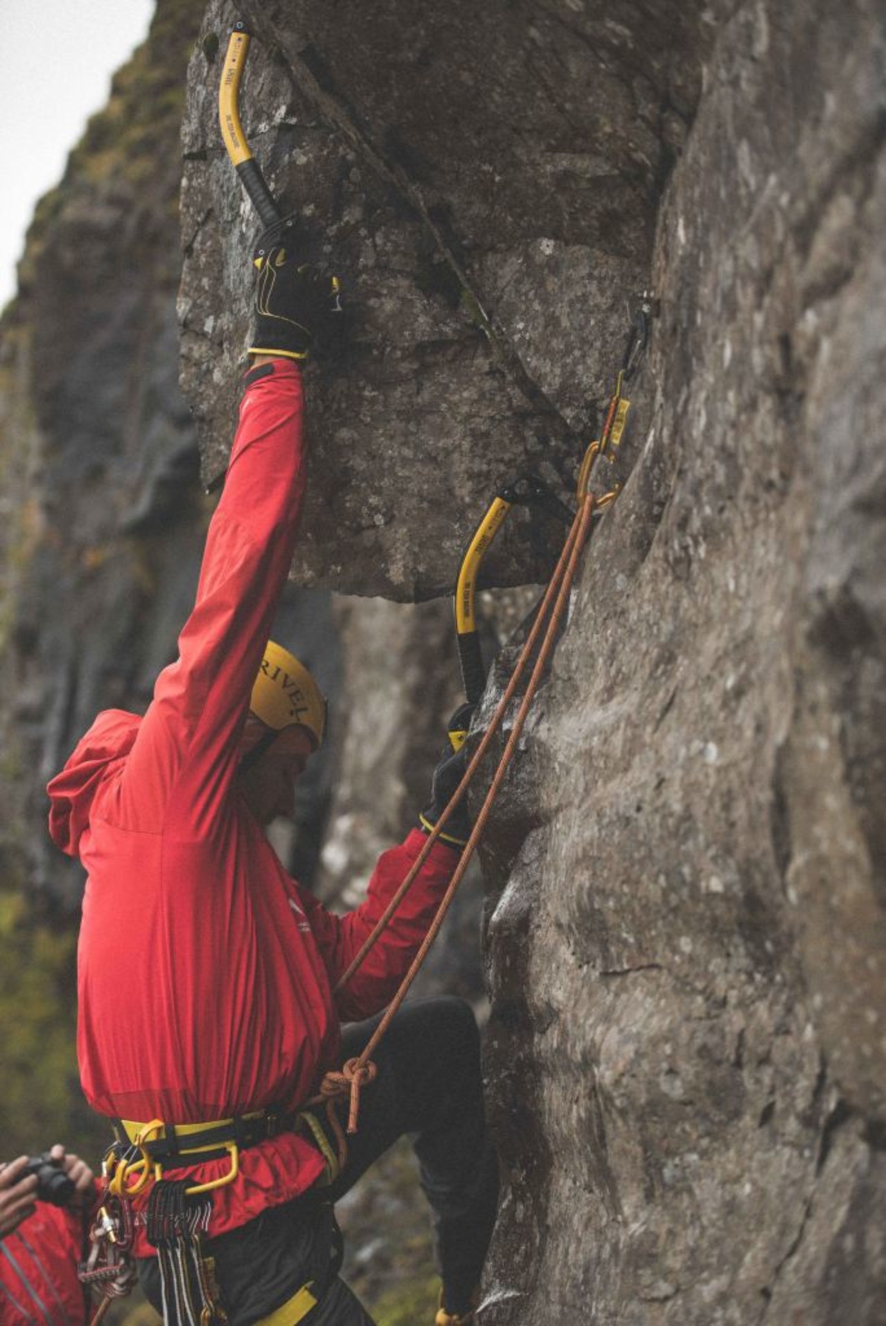 Icelandic Mountain Guide climbing a rock in Iceland