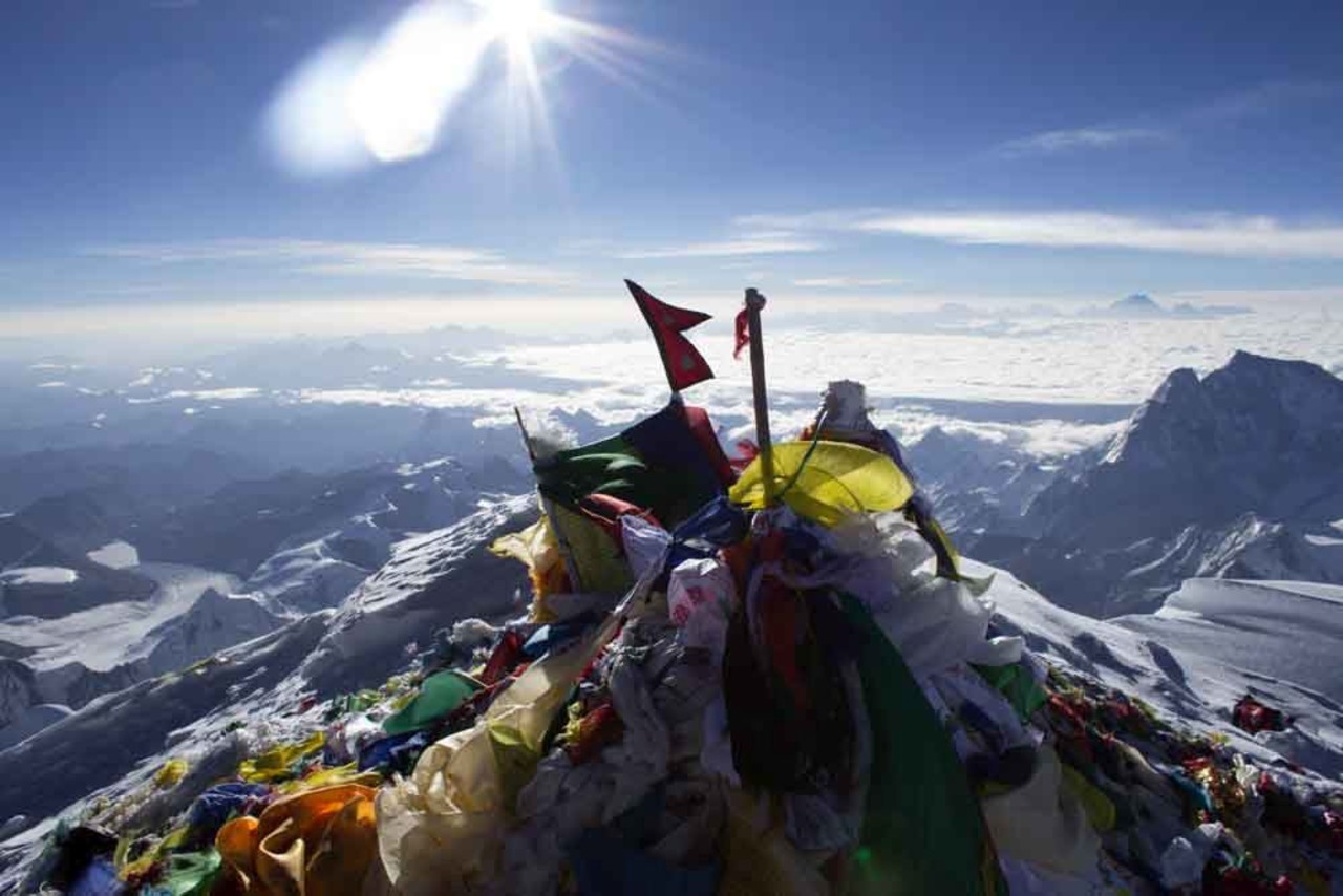 The summit of Mt:Everest, covered in Nepalese prayer flags.