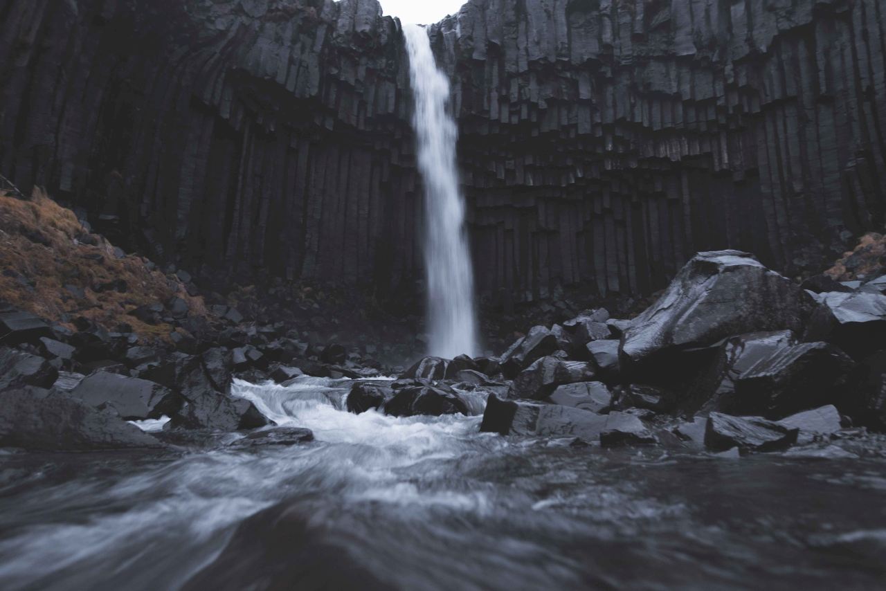 The waterfall Svartifoss in Skaftafell flows down the black rocks